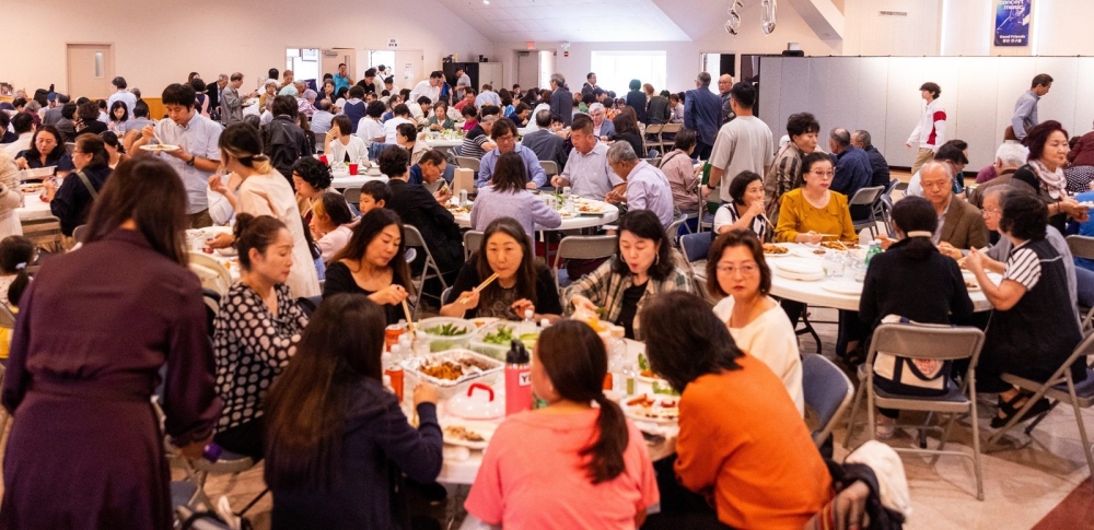 Parishioners and guests at St. Andrew Kim Parish in Olney, Maryland, enjoy Korean cuisine at a luncheon following a Mass on Sept. 29, 2024 at the parish that serves Korean Catholics in this area. (Catholic Standard photo by Mihoko Owada)